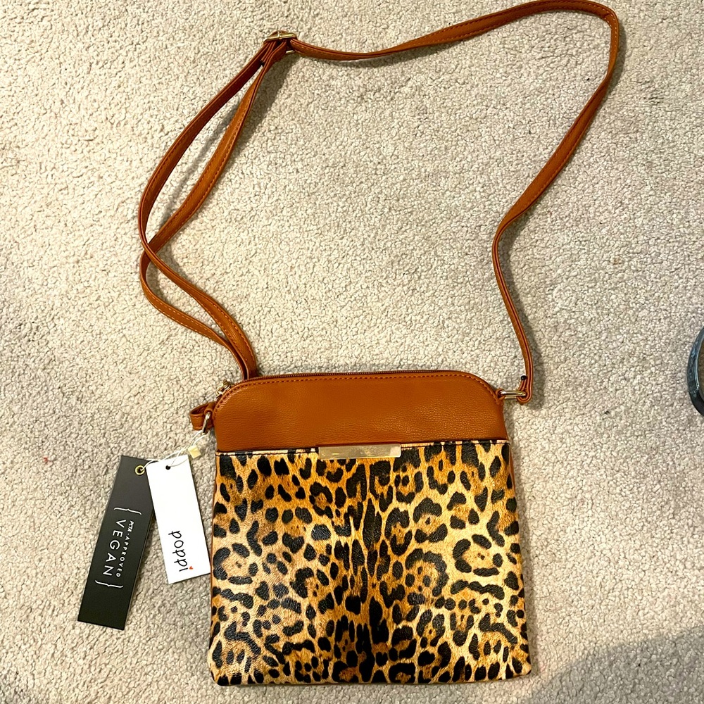 Cross body animal print bag. New with tags! Never used.